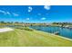 Beautiful waterfront view featuring private boat docks and well-maintained green lawns, perfect for relaxation at 714 N Waterway Dr, Venice, FL 34285