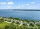 Aerial view of a community near a bay, showcasing the property's proximity to the water at 76 Tidy Island Blvd, Bradenton, FL 34210