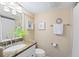 Cozy bathroom with neutral tones and a vanity featuring a granite countertop at 76 Tidy Island Blvd, Bradenton, FL 34210