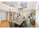 Elegant dining area with a chandelier, hardwood floors, and view to living room at 76 Tidy Island Blvd, Bradenton, FL 34210