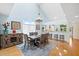 Open dining area with vaulted ceilings, chandelier, and seamless access to the kitchen at 76 Tidy Island Blvd, Bradenton, FL 34210