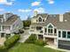 Two-story home with a well-manicured lawn and a patio perfect for outdoor entertaining at 76 Tidy Island Blvd, Bradenton, FL 34210