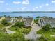 Stunning waterfront homes with lush landscaping and inviting curb appeal in a desirable community at 76 Tidy Island Blvd, Bradenton, FL 34210