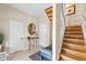Inviting foyer with a staircase, neutral walls, and decor at 76 Tidy Island Blvd, Bradenton, FL 34210
