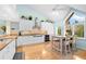 Bright, open kitchen with stainless steel appliances, countertops, and a cozy breakfast nook at 76 Tidy Island Blvd, Bradenton, FL 34210