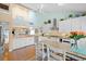 Bright, open kitchen with stainless steel appliances, countertops, and seamless access to living area at 76 Tidy Island Blvd, Bradenton, FL 34210