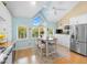 Bright kitchen features stainless steel appliances and a view of the outdoors at 76 Tidy Island Blvd, Bradenton, FL 34210