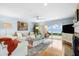 Bright living room featuring a sliding glass door with a view of the water at 76 Tidy Island Blvd, Bradenton, FL 34210