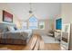 Inviting primary bedroom with beautiful water views from multiple windows and a vaulted ceiling at 76 Tidy Island Blvd, Bradenton, FL 34210