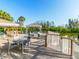 Outdoor deck with tables and chairs, perfect for enjoying the serene water views at 76 Tidy Island Blvd, Bradenton, FL 34210