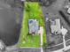 Aerial view of the home, highlighting the pool, landscaping, and proximity to the lake at 7832 Panther Ridge Trl, Bradenton, FL 34202