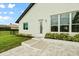 Well-maintained backyard with manicured landscaping, a tiled patio, and a private entrance at 7832 Panther Ridge Trl, Bradenton, FL 34202