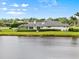 House with manicured backyard and view of the lake at 7832 Panther Ridge Trl, Bradenton, FL 34202