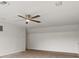 Bedroom featuring plush carpet, neutral walls and a modern ceiling fan at 7832 Panther Ridge Trl, Bradenton, FL 34202