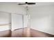 The bedroom features hardwood floors, a ceiling fan, a closet, and a built-in desk at 7832 Panther Ridge Trl, Bradenton, FL 34202