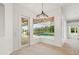 Dining area with an outdoor view of the screened in pool through a bay window at 7832 Panther Ridge Trl, Bradenton, FL 34202