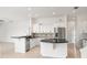 Modern kitchen with sleek black countertops, white cabinetry, and stainless steel appliances at 7832 Panther Ridge Trl, Bradenton, FL 34202