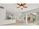Open living space featuring a spacious floor plan that connects the kitchen and screened patio at 7832 Panther Ridge Trl, Bradenton, FL 34202