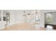 Bright living area featuring tile flooring, modern light fixtures, and architectural columns at 7832 Panther Ridge Trl, Bradenton, FL 34202
