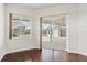The living room has hardwood floors, big windows, and sliding glass doors to a covered patio at 7832 Panther Ridge Trl, Bradenton, FL 34202