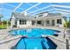 Inviting screened-in pool area with a jacuzzi and ample space for lounging and outdoor entertaining at 7832 Panther Ridge Trl, Bradenton, FL 34202