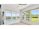Bright sunroom featuring many windows that overlook the pool, providing serene natural light at 7832 Panther Ridge Trl, Bradenton, FL 34202