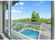 View from the window overlooking the screened-in pool and backyard at 7832 Panther Ridge Trl, Bradenton, FL 34202