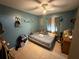 Inviting bedroom with tile floors and a ceiling fan, offering a cozy space to relax at 815 12Th W Ave, Bradenton, FL 34205
