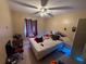 Generously sized bedroom offering tile floors, a ceiling fan, and good natural light at 815 12Th W Ave, Bradenton, FL 34205
