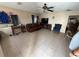 Spacious living room with tile flooring, ceiling fan, and ample space for furniture at 815 12Th W Ave, Bradenton, FL 34205
