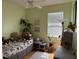 Cute bedroom features hardwood floors, teddy bears and a window for natural light at 817 Tallgrass Ln, Bradenton, FL 34212