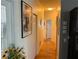 Bright hallway with hardwood floors and neutral paint, offers a clean and modern feel at 817 Tallgrass Ln, Bradenton, FL 34212