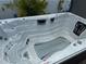 Large hot tub with multiple jets and seating areas at 817 Tallgrass Ln, Bradenton, FL 34212