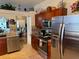 Modern kitchen featuring stainless steel appliances and dark wood cabinetry at 817 Tallgrass Ln, Bradenton, FL 34212