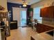 Bright kitchen with a sliding glass door to the outdoor space, perfect for entertaining at 817 Tallgrass Ln, Bradenton, FL 34212