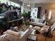 Bright living room features a large window, hardwood floors and stylish furniture at 817 Tallgrass Ln, Bradenton, FL 34212