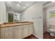 Bright bathroom with large mirror, vanity, and glass shower at 8255 Longbay Blvd, Sarasota, FL 34243