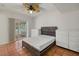 Bedroom with sliding glass door and two dressers at 8255 Longbay Blvd, Sarasota, FL 34243