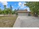 Attached two-car garage with a basketball hoop and spacious driveway at 8255 Longbay Blvd, Sarasota, FL 34243