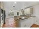 Bright kitchen features tile floors, granite countertops, stainless appliances and an open floorplan at 8255 Longbay Blvd, Sarasota, FL 34243