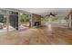 Cozy sunroom featuring fireplace and access to outdoor space at 8255 Longbay Blvd, Sarasota, FL 34243