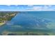 Scenic view of a waterway with trees lining the shore and the city skyline in the distance at 8255 Longbay Blvd, Sarasota, FL 34243