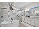 Luxurious bathroom with a soaking tub and walk-in shower with black fixtures at 8272 Redonda Loop, Bradenton, FL 34202