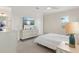 Bright bedroom with a comfortable bed, lots of light and a television on the wall at 8272 Redonda Loop, Bradenton, FL 34202