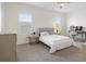 Cozy bedroom with a comfortable bed, neutral tones, and bright windows with shutters at 8272 Redonda Loop, Bradenton, FL 34202