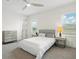 Inviting bedroom with a queen bed, contemporary furnishings, and an abundance of natural light at 8272 Redonda Loop, Bradenton, FL 34202