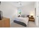 Comfortable bedroom with a ceiling fan and two bedside lamps on nightstands at 8272 Redonda Loop, Bradenton, FL 34202