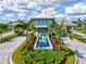 A closer view of The Isles gatehouse showcases a tranquil water feature and well-maintained grounds at 8272 Redonda Loop, Bradenton, FL 34202