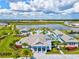 Community pool with a sun deck and other amenities overlooking the lake at 8272 Redonda Loop, Bradenton, FL 34202