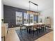 Elegant dining room features a modern light fixture and three large windows at 8272 Redonda Loop, Bradenton, FL 34202